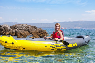 Woman kayaking in Croatia