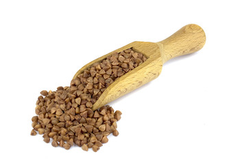 Buckwheat on wooden scoop isolated on white background