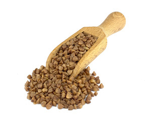 Buckwheat on wooden scoop isolated on white background