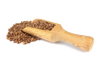 Buckwheat on wooden scoop isolated on white background