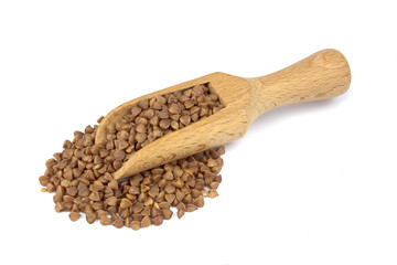 Buckwheat on wooden scoop isolated on white background