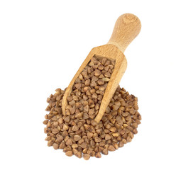 Buckwheat on wooden scoop isolated on white background