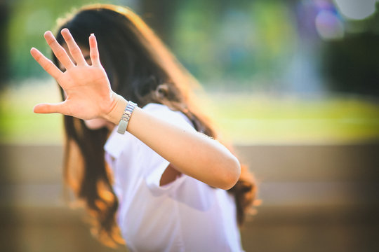 Girl Show Hand Up, Symbol Of Stop. Invisible Face, A Young Girl With Hand Out. Body Language To Say 