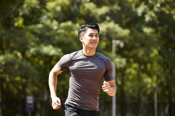 young asian male athlete running