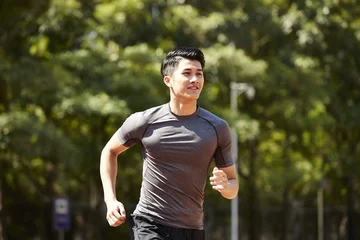 Photo sur Aluminium Jogging young asian male athlete running