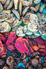 Vegetables baked on fire. Potatoes, sweet peppers, mushrooms, zucchini.