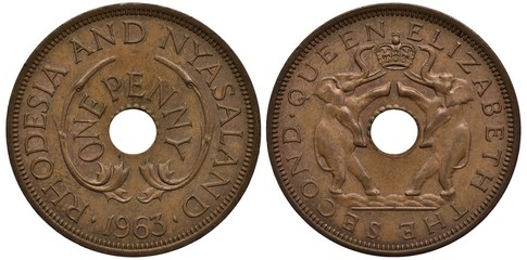 Rhodesia and Nyasaland coin 1 one penny 1963, value surrounds center hole, two elephants flank...