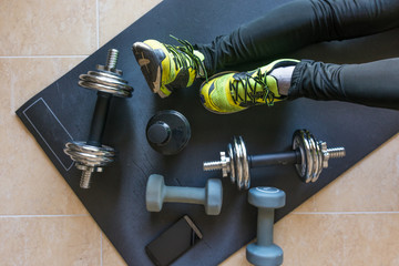 Dumbbell and mat training at home,