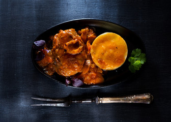 Osso Buco Veal shanks Prepared with mashed potatoes in a cast-iron pan