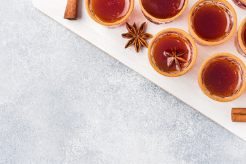 Mulled wine cider in small stacks with cinnamon and anise. The concept of the cocktail bar. Top view Copy space
