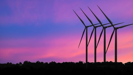 Silhouettes Wind turbine power generators at sunset, Alternative renewable energy production, Large...