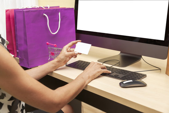 happy woman using laptop or holding credit card while Buy and Sell or shopping online with customers or entrepreneurs,Small Business lifestyle Payment Transaction at Computer using Credit Card Concept