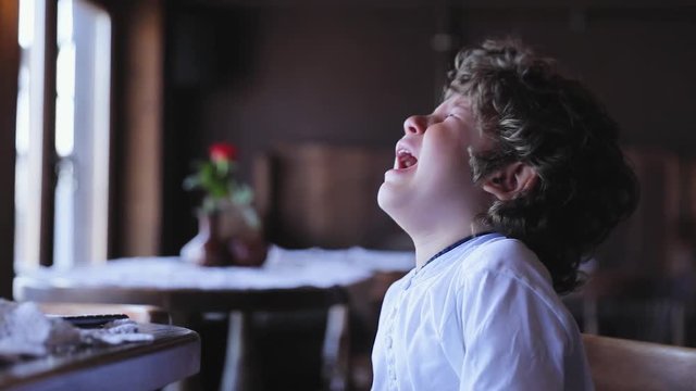 Boy Crying. Upset Little Child Cry At Cafe