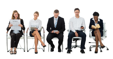 Obraz premium Group Of Businesspeople Waiting For Interview