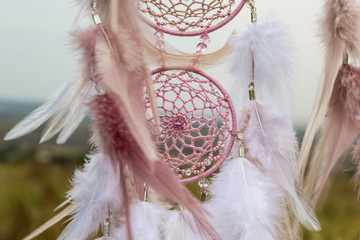 Handmade dream catcher with feathers threads and beads rope hanging - obrazy, fototapety, plakaty
