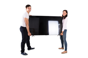 Happy Couple Holding Television