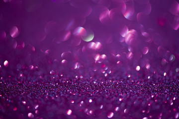 Shining abstract bokeh background with purple glitter vintage lights