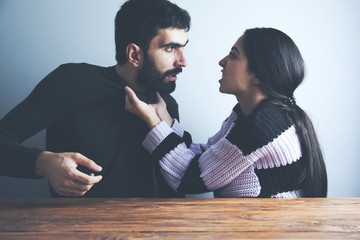 young angry couple in home