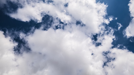 dark sky with white clouds