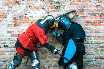 Fight, the struggle of medieval knights in armor.