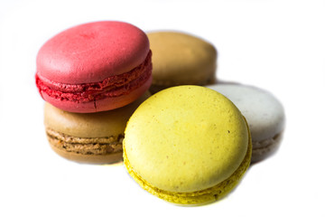 Colorful french macaroons on the blue table close up view