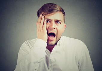 young man with shocked facial expression