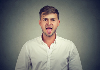 portrait of a man sticking his tongue out