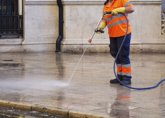 City workers - cleaning and washing of city streets
