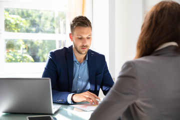 Businessman Looking At Job Candidate