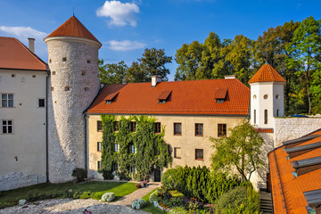Pieskowa Skala, Poland - Inner courtyard and gothic tower of historic castle Pieskowa Skala by the Pradnik river in the Ojcowski National Park