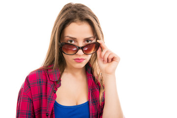 Suspicious modern woman in sunglasses