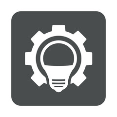 cono plano bombilla con engranaje en cuadrado gris