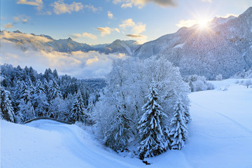 Fototapeta na wymiar Beautiful morning sunrise view of fresh powder snow in the mountains of the Brandnertal in the Alps in Vorarlberg, Austria, in winter