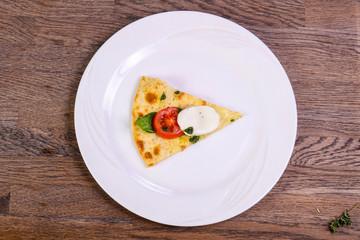 Pizza Caprese with basil