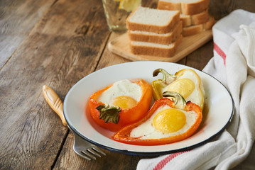 Baked bell pepper with egg in a bowl