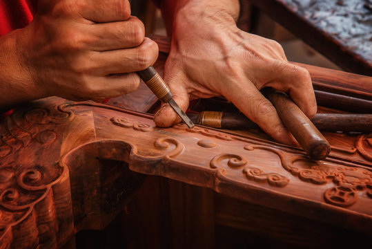Carving and polishing of mahogany furniture