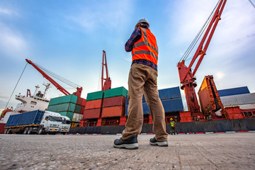 the loading and discharging operation container ship vessel in port takes control by stevedore and...