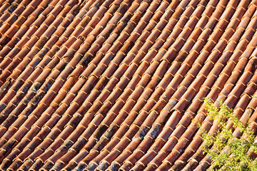red tiles on the roof of the house.