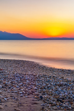 Early morning , dramatic sunrise over sea and mountain. Photographed in Asprovalta, Greece.