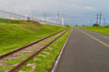 Fototapeta na wymiar Road and a railway passing by Gatun Locks, part of Panama Canal