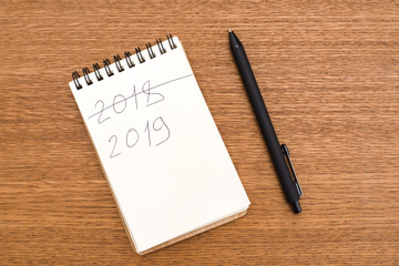 A notebook where you crossed out the inscription 2018 and written 2019