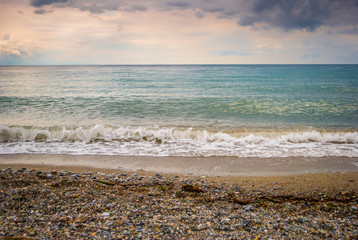 The sea shore, with blue sky and clouds and clear sea