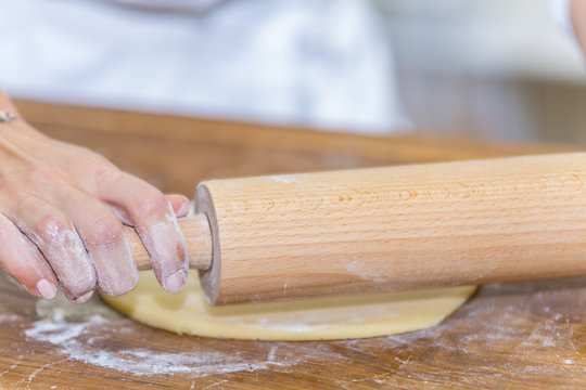 The Chef In The Kitchen Prepares Dough For A Cake. Close Up