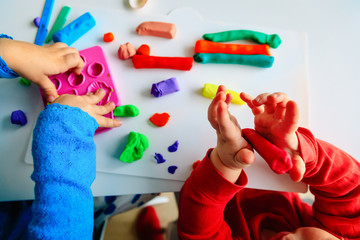 kids play with clay molding shapes, learning through play - obrazy, fototapety, plakaty