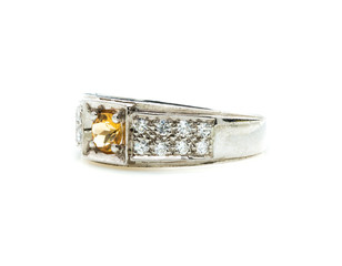 classic ring with a yellow topaz stone on white background