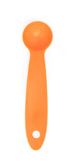 orange measuring spoons isolated on white background