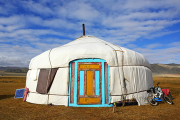 Landscape of yurt traditional nomadic homes for Western Mongolians on the steppe with beautiful blue sky background
