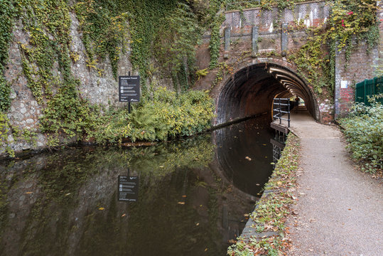 The Edgbaston Tunnel, along the Worcester to Birmingham Canal, in England, UK. The day is still and the water is very calm