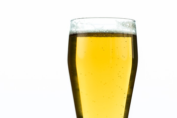 glass of beer with foam isolated on white