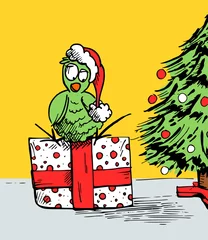 Muurstickers Cartoon - vogel zit met een kerstmuts op een cadeautje bij de kerstboom - te gebruiken als kerstkaart of voor willekeurig ander doeleinde © emieldelange